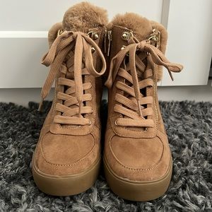 Guess tan/Brown wedge boot with faux fur trim. Very stylish